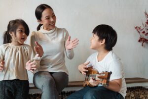 children singing with teacher