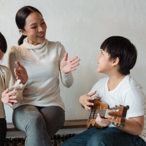 children singing with teacher