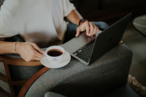 online coffee meet up photo of person with coffee at computer
