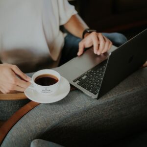 online coffee meet up photo of person with coffee at computer